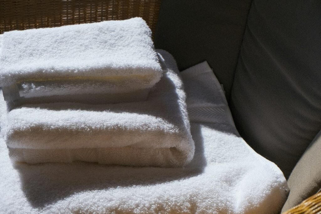 A stack of clean, folded white towels